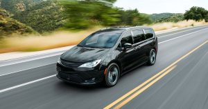 2020 Chrysler Pacifica in black driving down the road