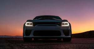 2020 Dodge Charger at night with the headlights on