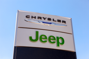 a sign with Chrysler and Jeep listed on it