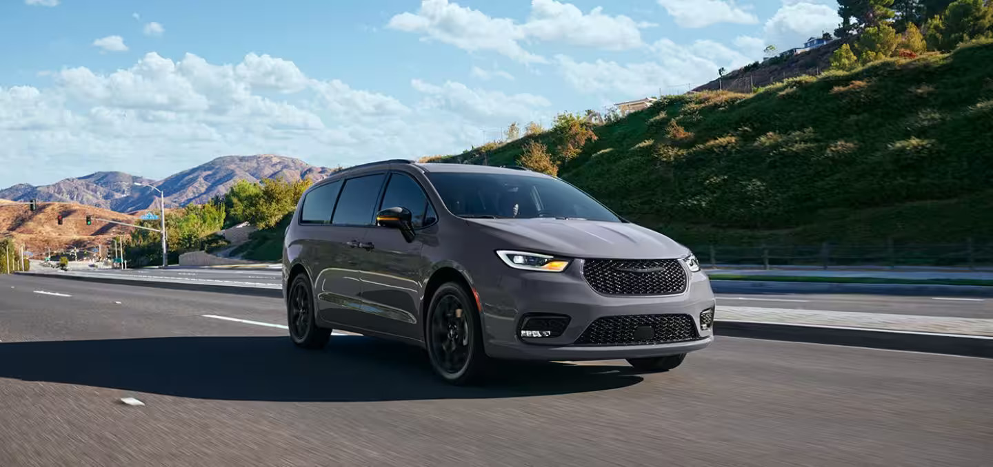 2024 gray Chrysler Pacifica driving on the open highway.